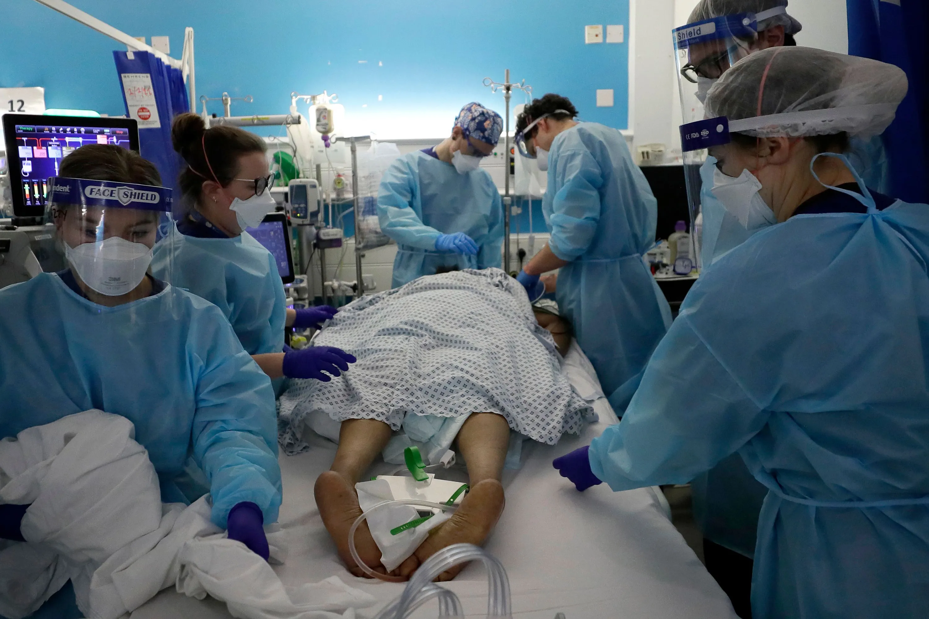 Critical Care staff look after a Covid-19 patient at King's College Hospital in London.