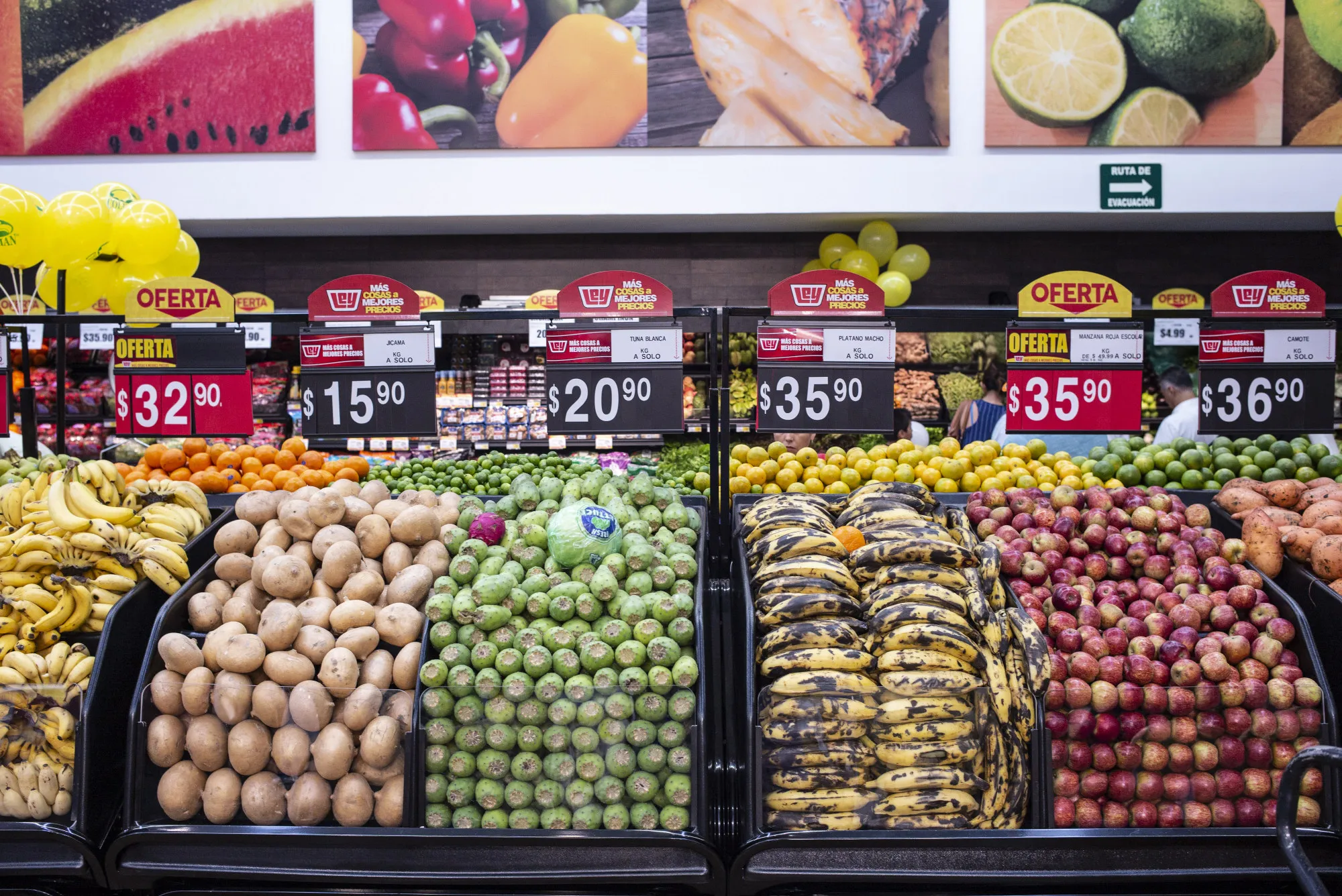 Fruit and vegetables sit on display for sale at a supermarket in Mexico.