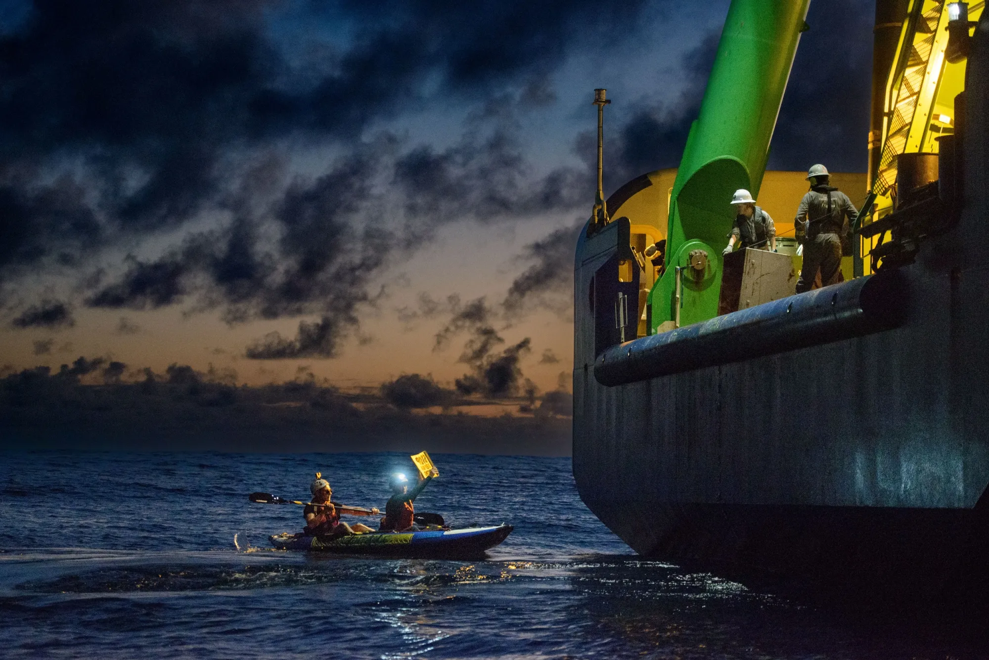 Greenpeace activists confront workers on a boat conducting deep sea mining research for The Metals Company.
