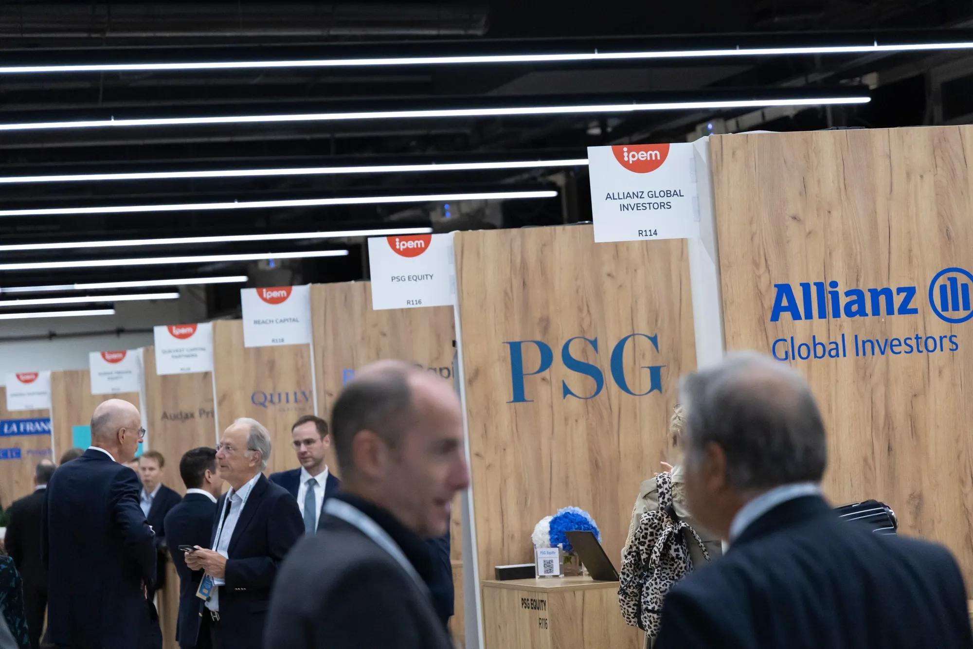 Attendees in a networking space at IPEM private equity conference in Paris on Sept. 25, 2025.