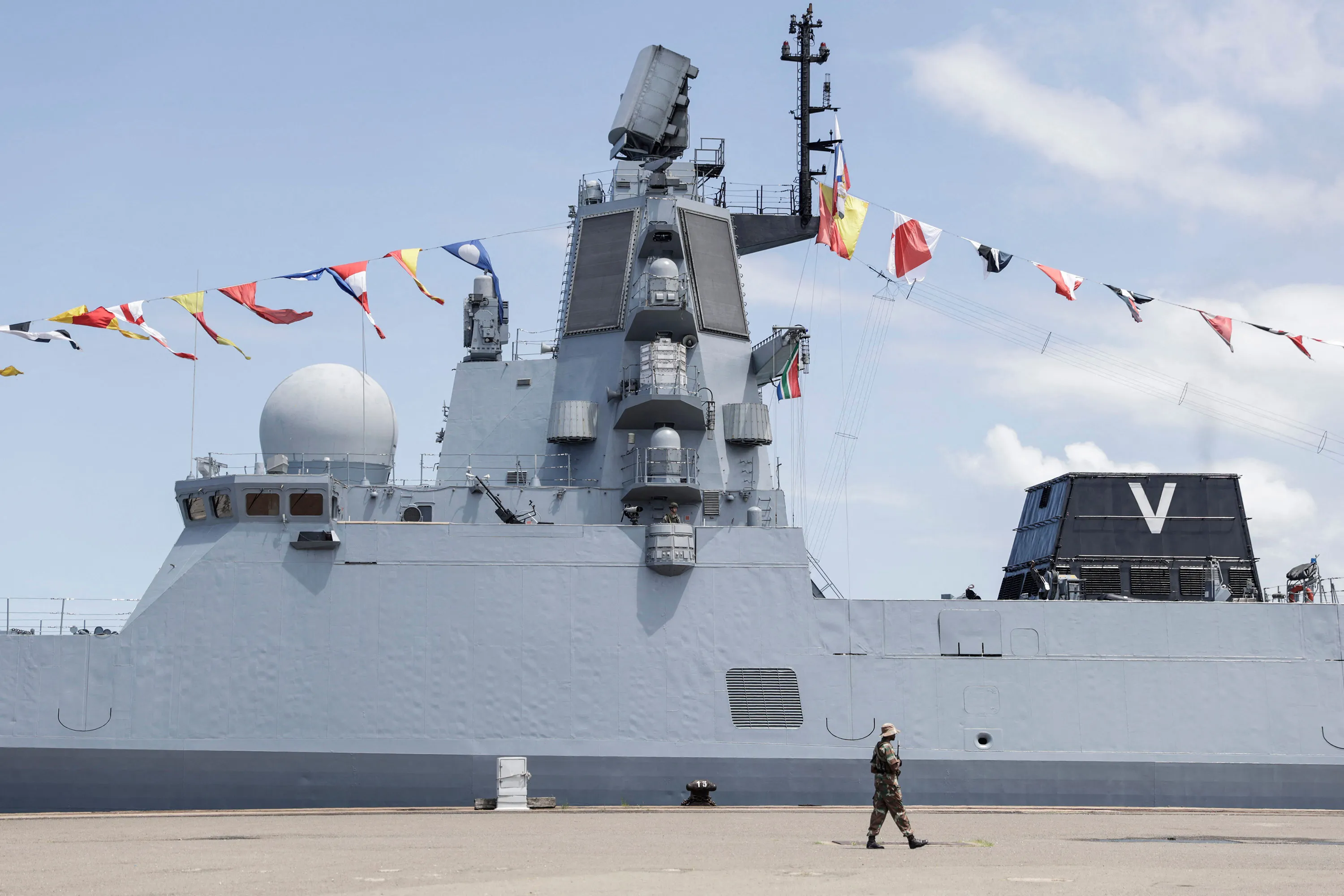 A South African National Defence Force soldier walks past the Russian military frigate ‘Admiral Gorshkov’&nbsp;in Richards Bay, South Africa, on Feb. 22.