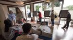 Residents receive their ballots as others cast their votes during the presidential primary election in San Francisco on June 7, 2016.
