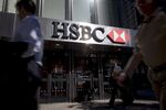 Pedestrians walk past an HSBC Holdings Plc bank branch in New York.