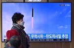 A television screen showing a news broadcast with file footage of a North Korean missile test, at a railway station in Seoul on March 5.