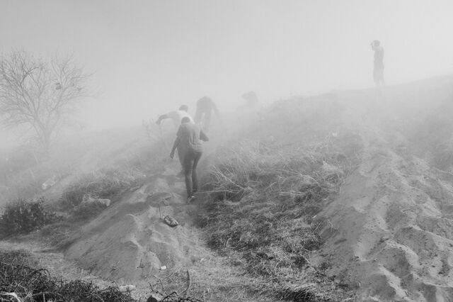 Migrants, fearing deportation, walk back towards Mexico after crossing the Rio Grande into the US.