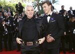 Director Baz Luhrmann, left, and Austin Butler pose for photographers upon arrival at the premiere of the film 'Elvis' at the 75th international film festival, Cannes, southern France, Wednesday, May 25, 2022. (Photo by Joel C Ryan/Invision/AP)