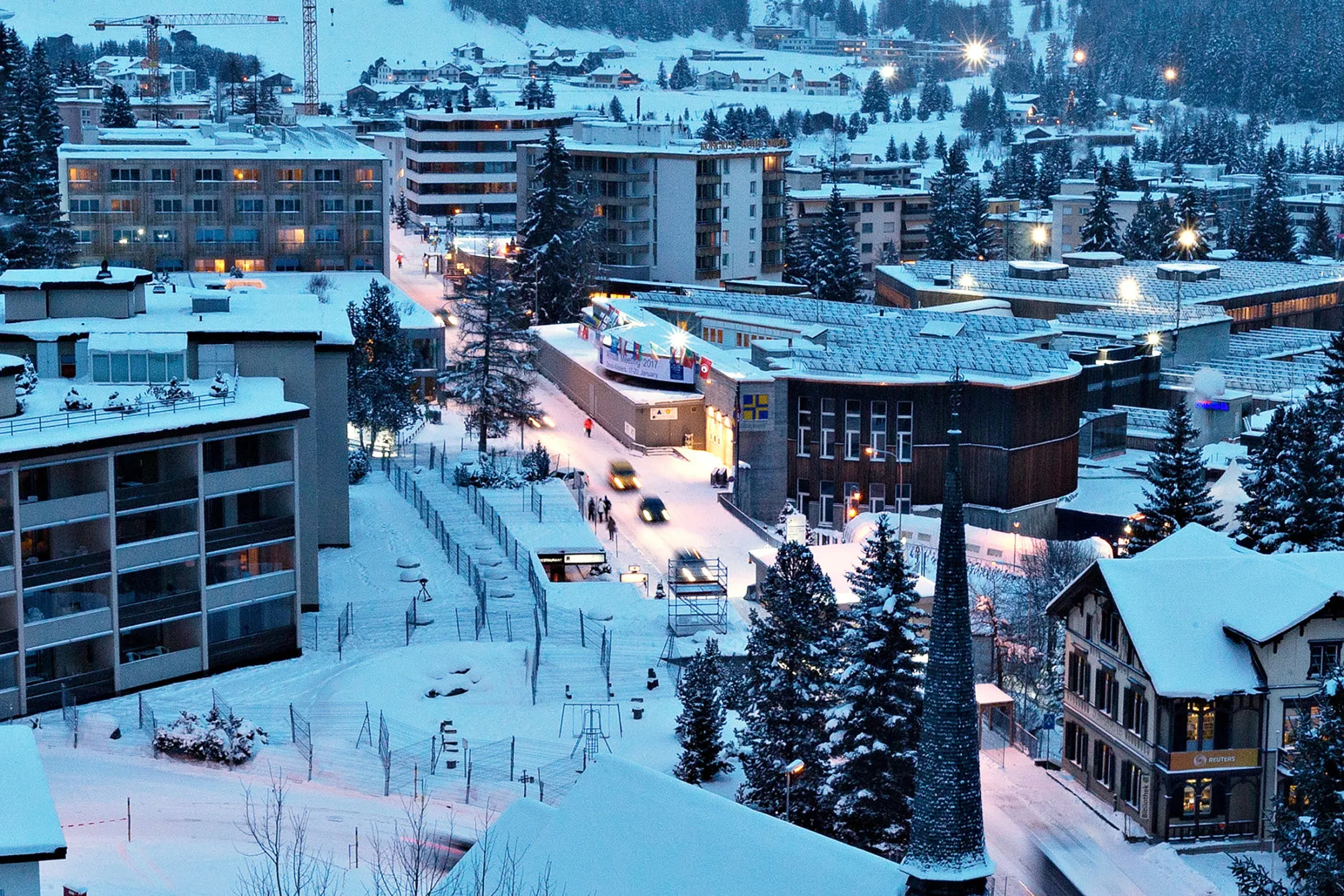The Congress Center, venue for the World Economic Forum (WEF), center, stands on the Promenade at dusk in Davos, Switzerland, on Saturday Jan. 14, 2017. World leaders, influential executives, bankers and policy makers attend the 47th annual meeting of the World Economic Forum (WEF) in Davos from Jan. 17-20.
