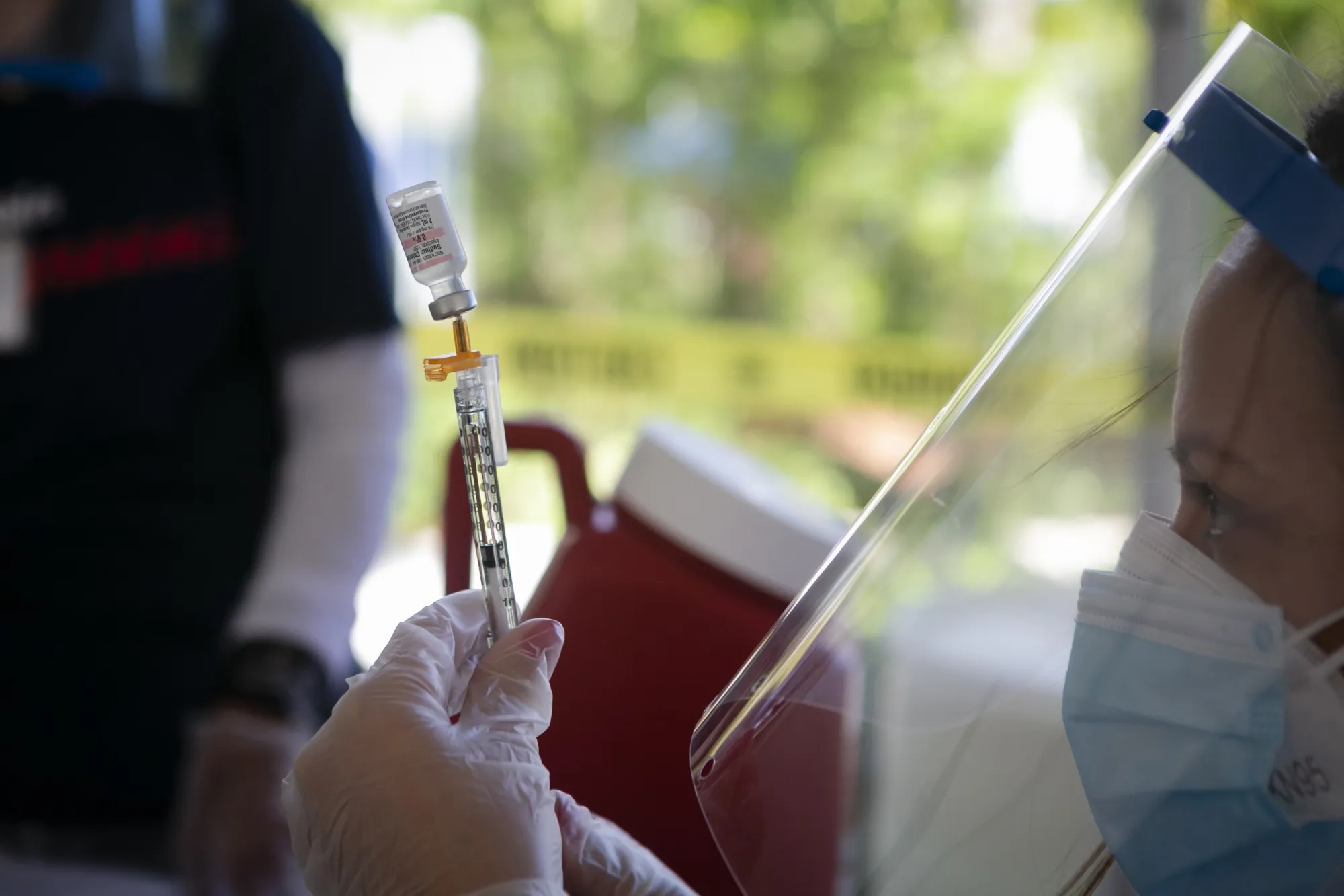 A healthcare worker prepares to administer a dose of the Pfizer-BioNTech Covid-19 vaccine.