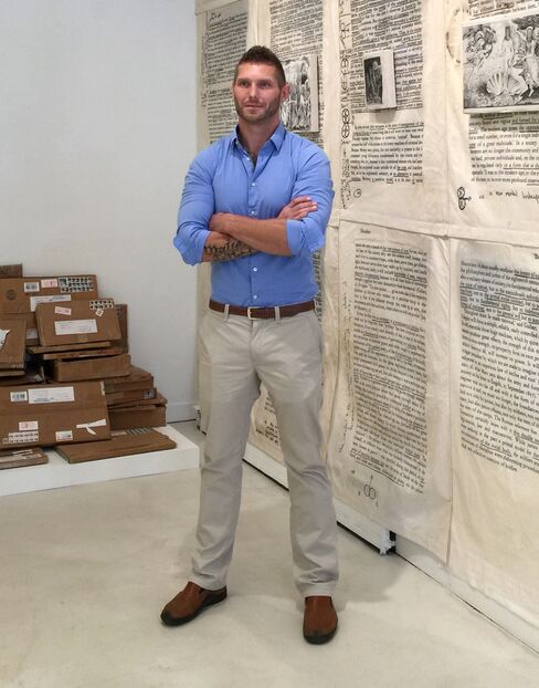 Krimes at his solo exhibition, "Marking Time in America: The Prison Works (2009-2013)," at Burning in Water gallery in NYC.