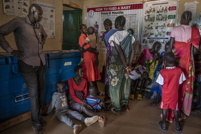 Women and children wait for malnutrition screening and food distribution at Koch County Hospital in June.