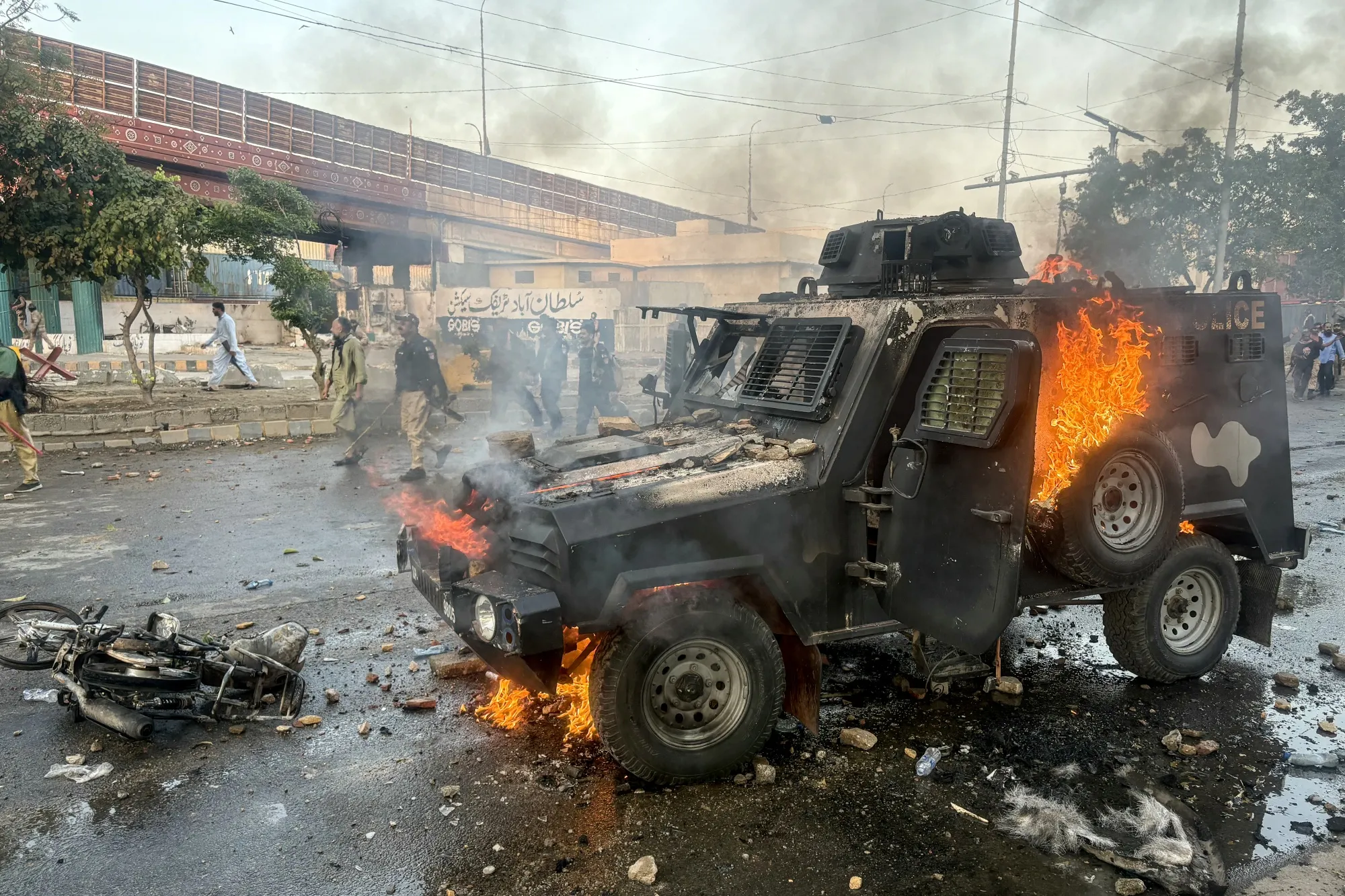 An armored vehicle set on fire by protesters outside the US consulate in Karachi on March 1.