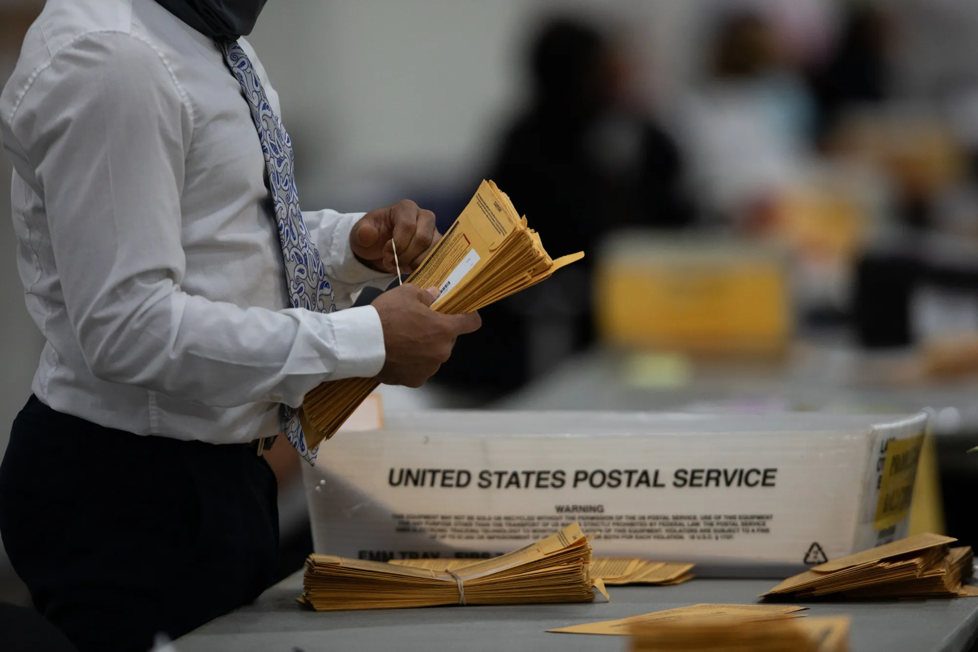 A volunteer&nbsp;processes&nbsp;ballots at the TCF Center in Detroit, Michigan, on Nov. 4.