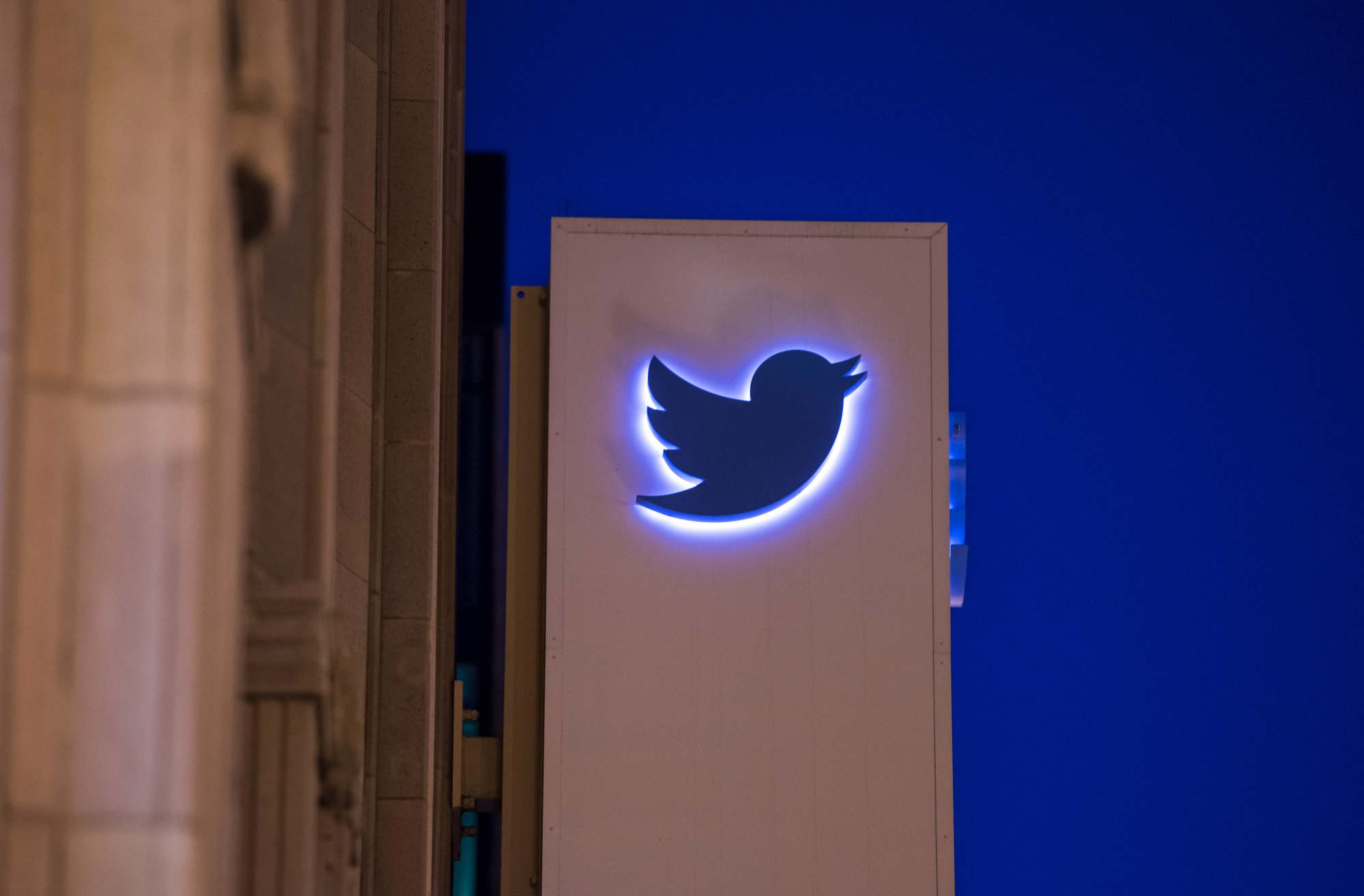 The Twitter Inc. logo and signage is displayed on the facade of the company's headquarters in San Francisco, California, U.S., on Wednesday, Oct. 21, 2015. Twitter Inc. is expected to release earnings figures on Oct. 27.
