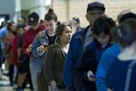 People wait in line to cast their ballots in Takoma Park, Md., a suburb of Washington, D.C.