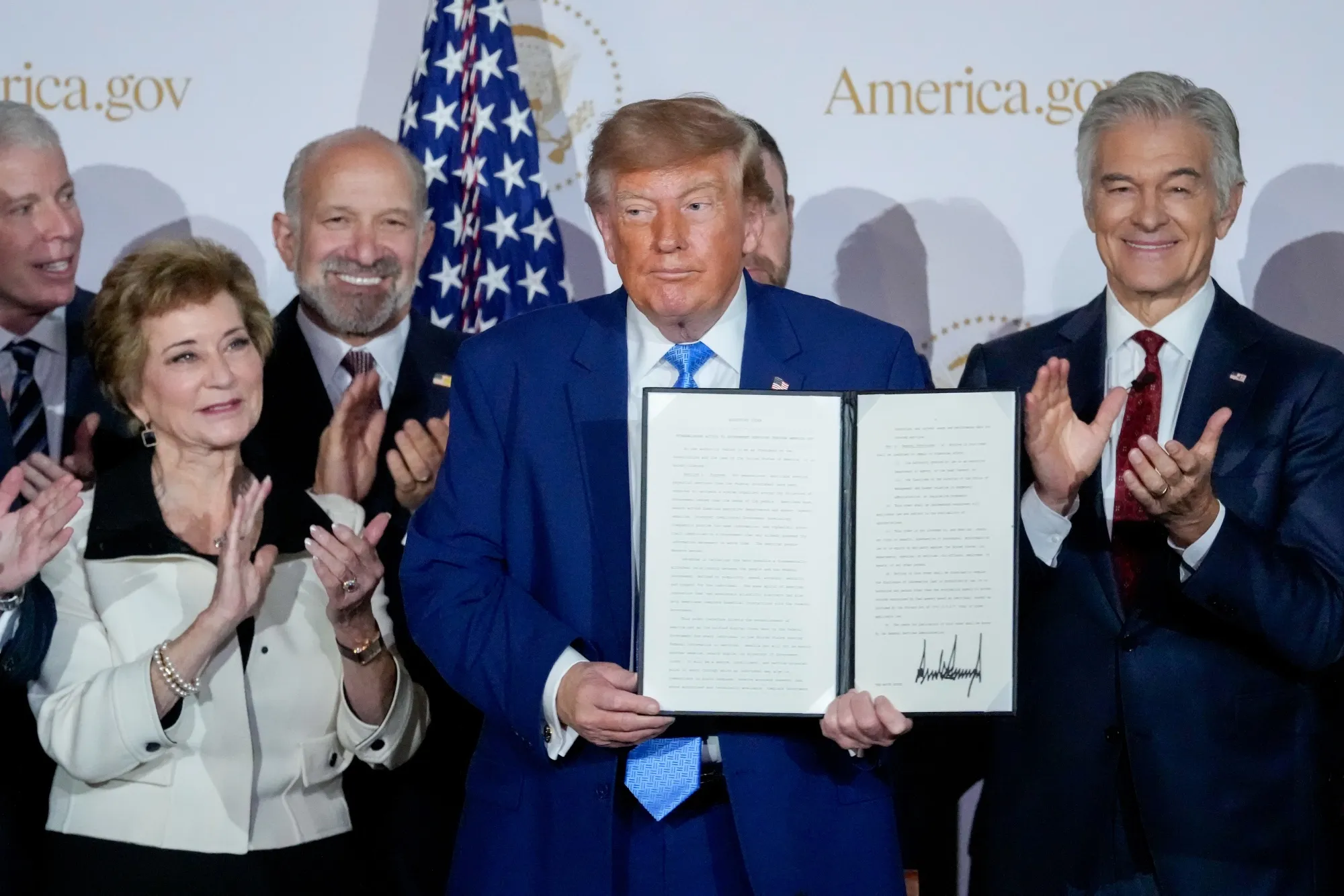 President Donald Trump displays a signed executive order on Tuesday, Sept. 29, 2026.