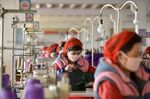 Workers of Songyo Knitwear Factory in Pyongyang produce masks for protection against the new coronavirus in this photo taken on Feb. 6, 2020.