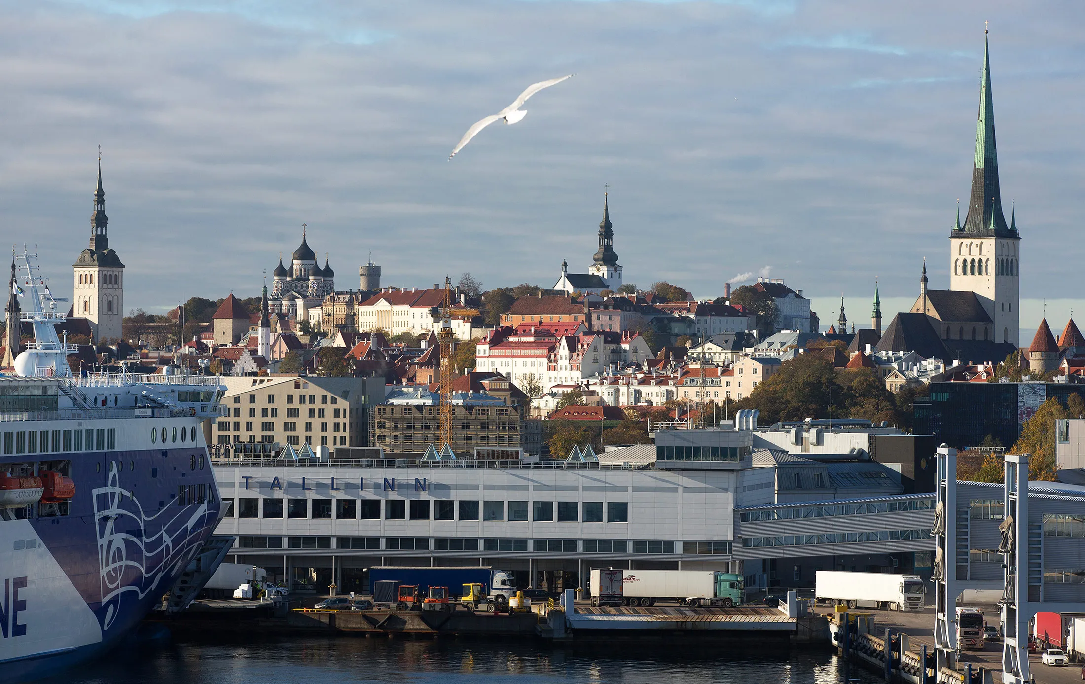 Passenger ferry MF Finlandia, operated by Eckero Line Ab Oy, left, stands moored at the old city harbor at the Port of Tallinn, as St. Olaf's church tower, right, stands on the skyline in Tallinn, Estonia, on Sunday, Oct. 16, 2016. Oil tanker rates jumped to a four month high as traders booked the most cargoes for the time of year on record, offering signs that Middle East producers could be adding barrels to the market just before OPEC embarks on its deepest output cuts in eight years.
