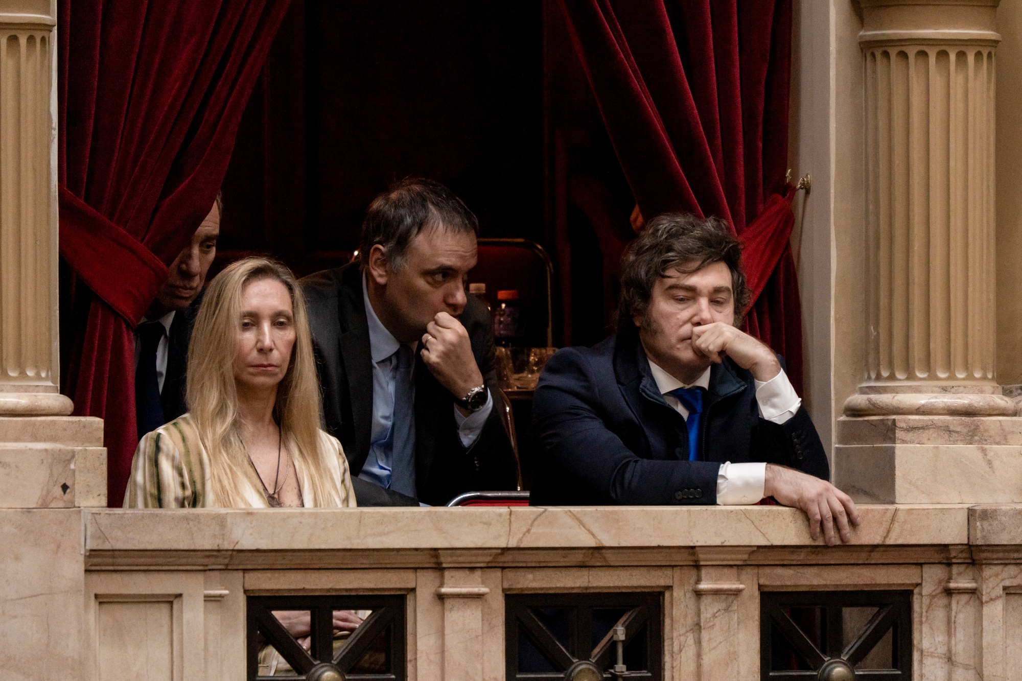 Diego Santilli, Argentina's interior minister, from left, Karina Milei, Argentina's general secretary of the presidency, Manuel Adorni, Argentina's cabinet chief, and Javier Milei, Argentina's president, during a swearing in ceremony at the National Congress in Buenos Aires, Argentina, on Wednesday, Dec. 3, 2025. Argentine President Javier Milei's popularity picked up after his party's landslide victory in midterm elections as both voter perceptions of his administration and economic expectations improved. Photographer: Anita Pouchard Serra/Bloomberg