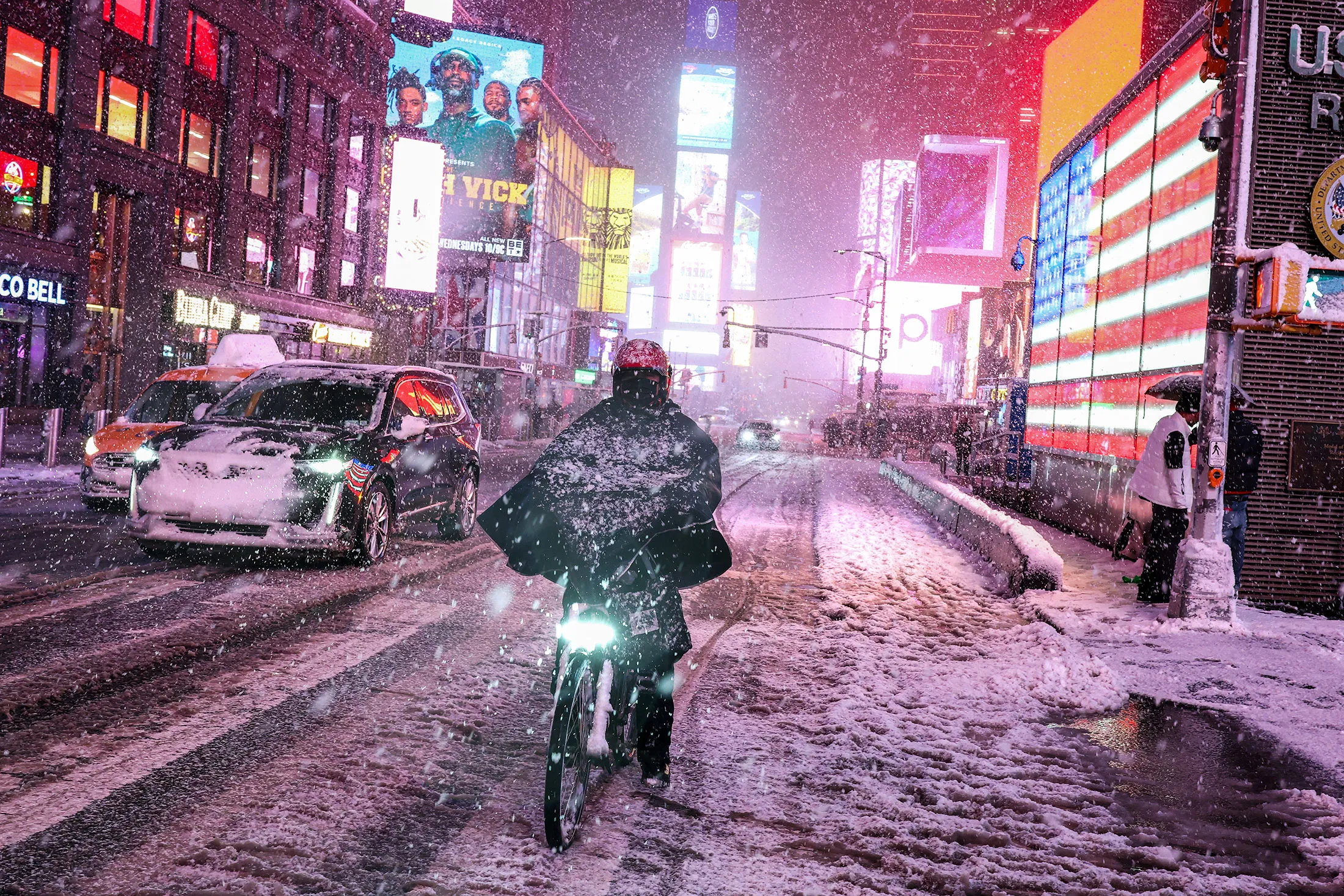 A cyclist navigates heavy snow in Times Square, new York, in February.