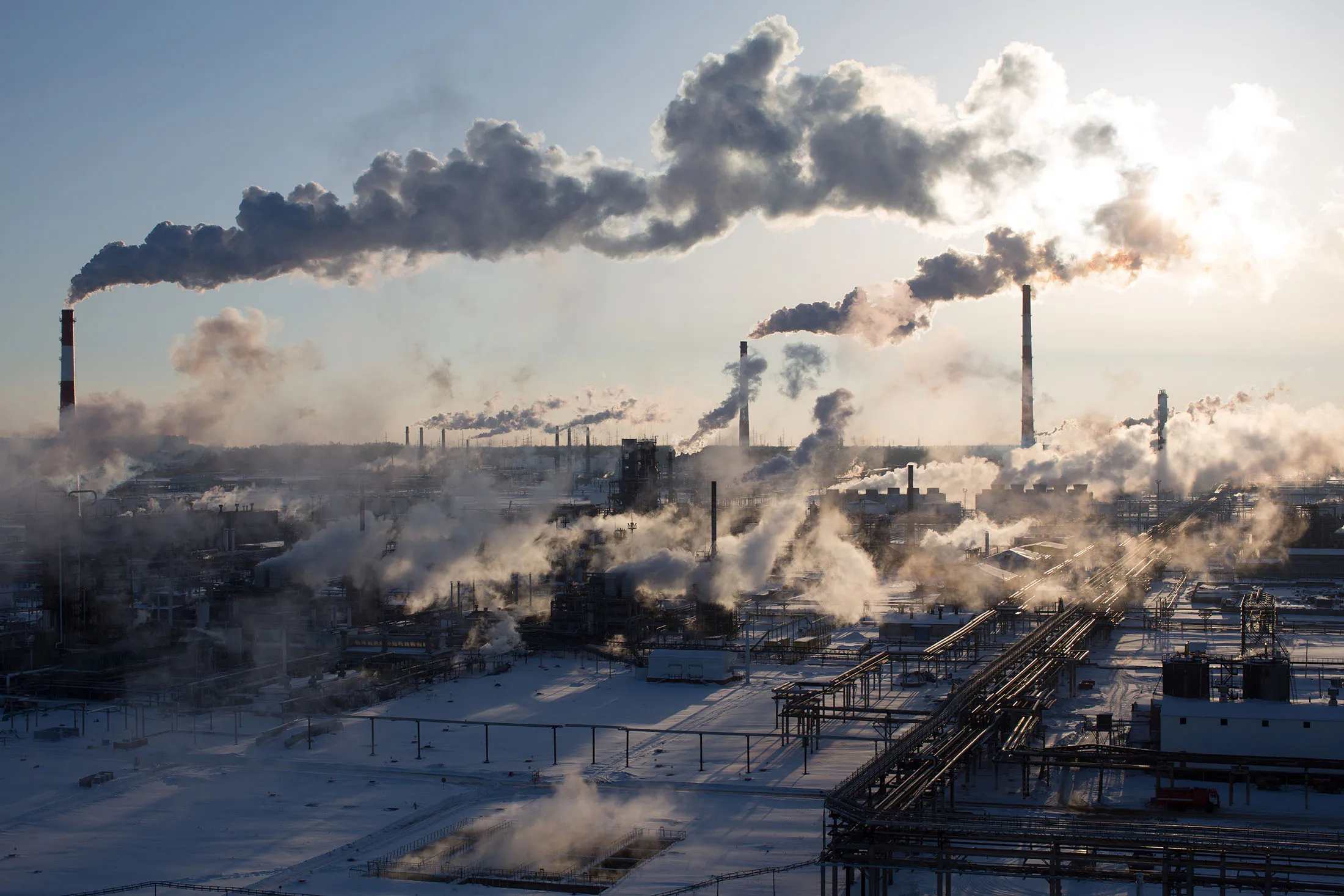 Chimneys emit vapor at the Novokuibyshevsk oil refinery plant, operated by Rosneft PJSC, in Novokuibyshevsk, Samara region, Russia, on Thursday, Dec. 22, 2016. Oil trimmed a second weekly gain as investors weighed rising U.S. inventories against coming coordinated output cuts by OPEC and other producing nations.

