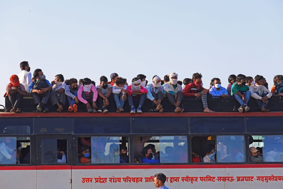 Truck Depots, Highways Checkpoints And Migrant Workers Walking on Foot As India Closes State Borders