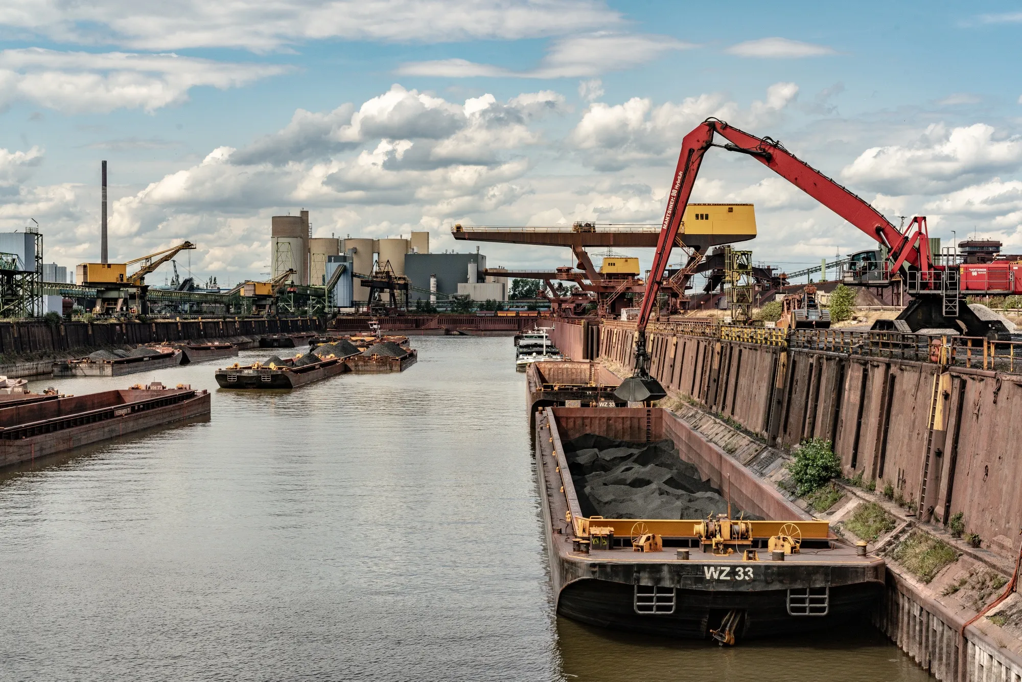 Coal barges&nbsp;being unloaded at the&nbsp;Thyssenkrupp AG area of the inland harbor&nbsp;in Duisburg,&nbsp;Germany, on July 20.