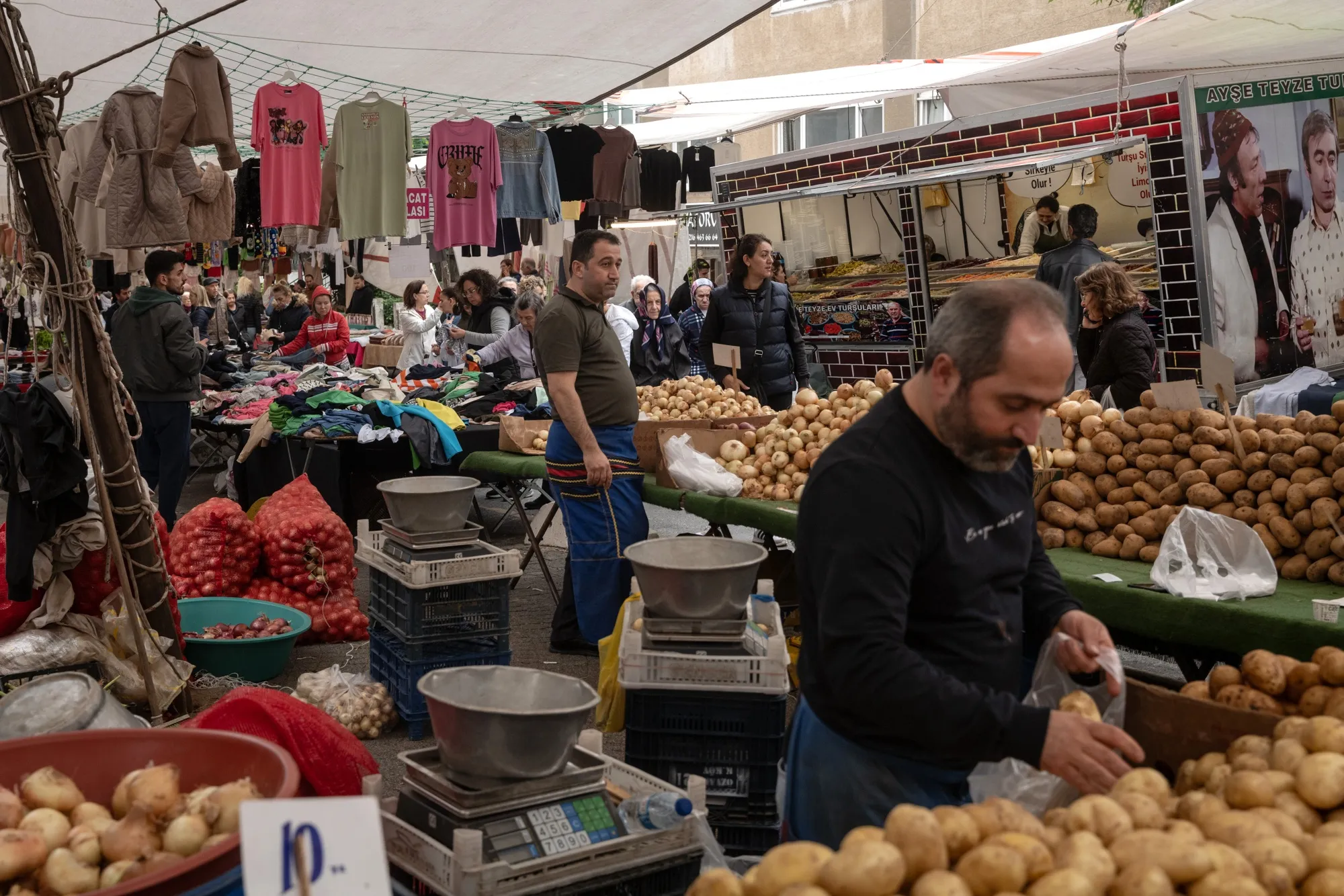 Vegetable vendors at the Friday Bazaar market in Istanbul, Turkey.