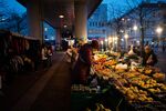 Shoppers at a fruit and vegetable stall in Vienna. Photographer Nina Riggio/Bloomberg