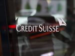 A Credit Suisse logo sits on the windows of a Credit Suisse Group AG bank branch in Zurich.