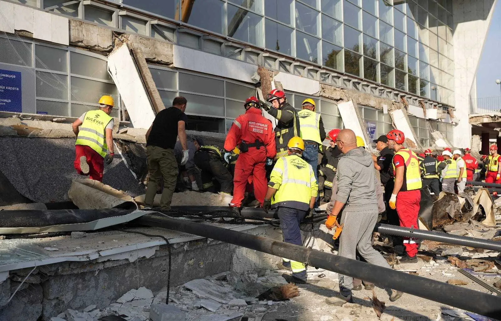 In this photograph distributed by Serbian Interior Ministry, emergency teams work on the scene where the concrete roofing of the train station collapsed, killing 8 people trapped in the rubble in Novi Sad, Serbia, on November 1.