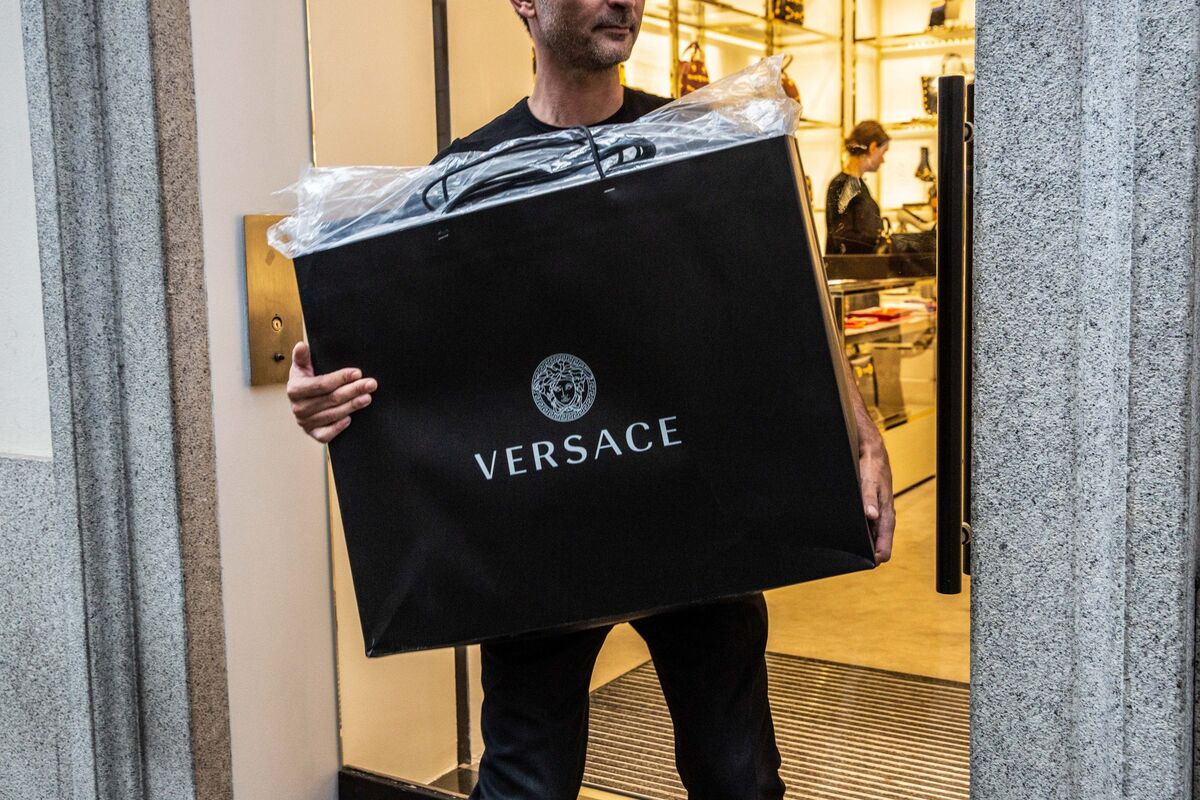 mk bought versace