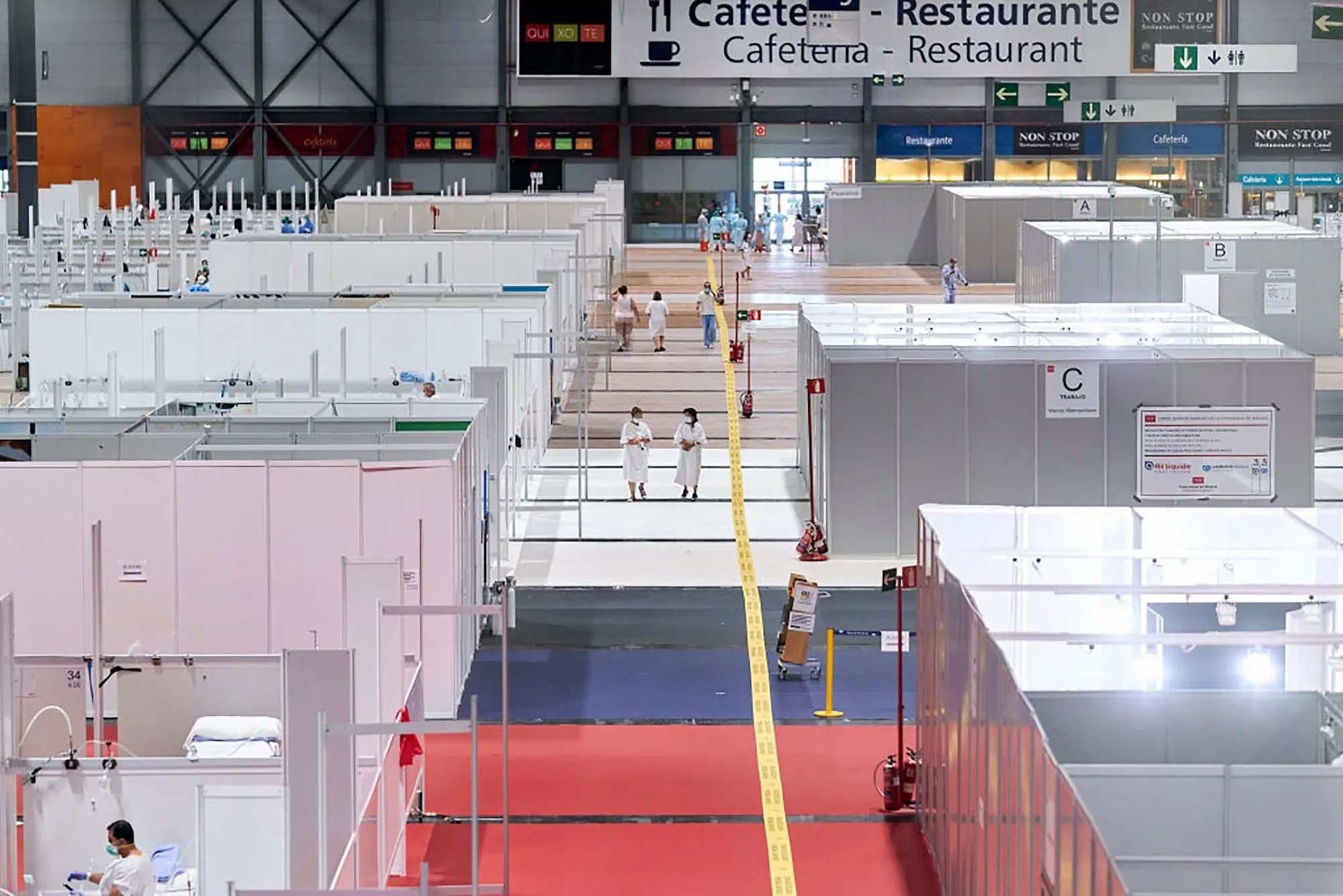 Patients walks across the field hospital installed at IFEMA in Madrid, on April 11.