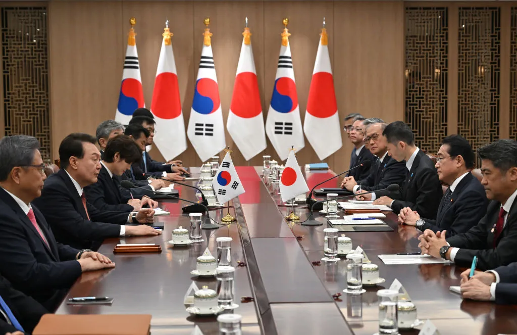 Yoon Suk Yeol&nbsp;talks with Fumio Kishida during their meeting at the presidential office in Seoul, May 7.