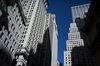 Buildings stand on Wall Street near the New York Stock Exchange (NYSE) in New York, U.S., on Monday, Feb. 22, 2016. Stocks retreated with government bonds, while the euro rallied to the highest level in almost a month as investors looked past an unprecedented boost from European monetary policy to focus on rising anxiety that policymakers have lost the ability to jumpstart global growth and stave off deflation.