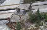 In this aerial photo, damage caused by heavy rains and mudslides earlier in the week is pictured along the Coquihalla Highway near Hope, British Columbia, Thursday, Nov. 18, 2021. (Jonathan Hayward/The Canadian Press via AP)