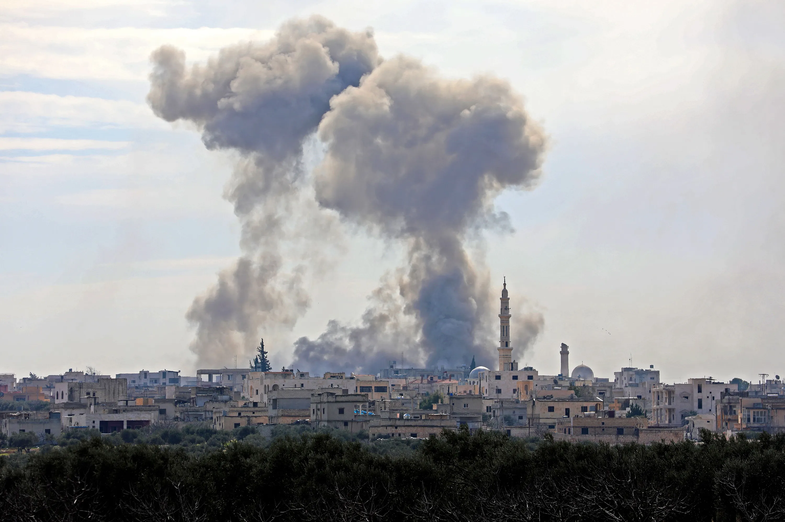 Smoke rises from the Syrian village of al-Nayrab, about 14 kilometres southeast of the city of Idlib, during bombardment by Syrian government forces and its allies.