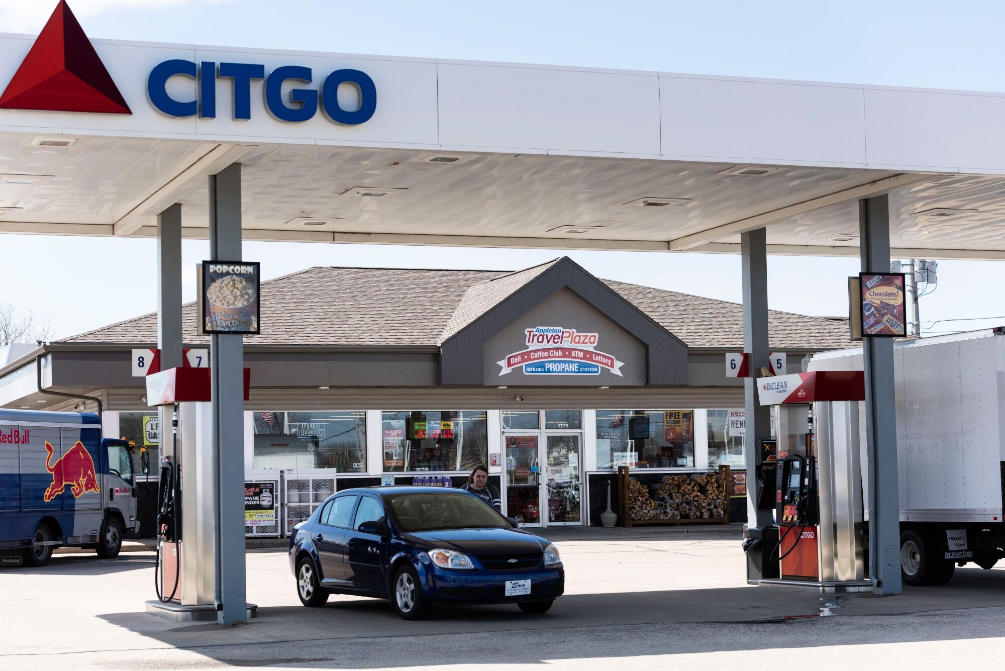 Vehicles refuel at a Citgo Petroleum Corp. gas station in Appleton, Wisconsin, U.S..