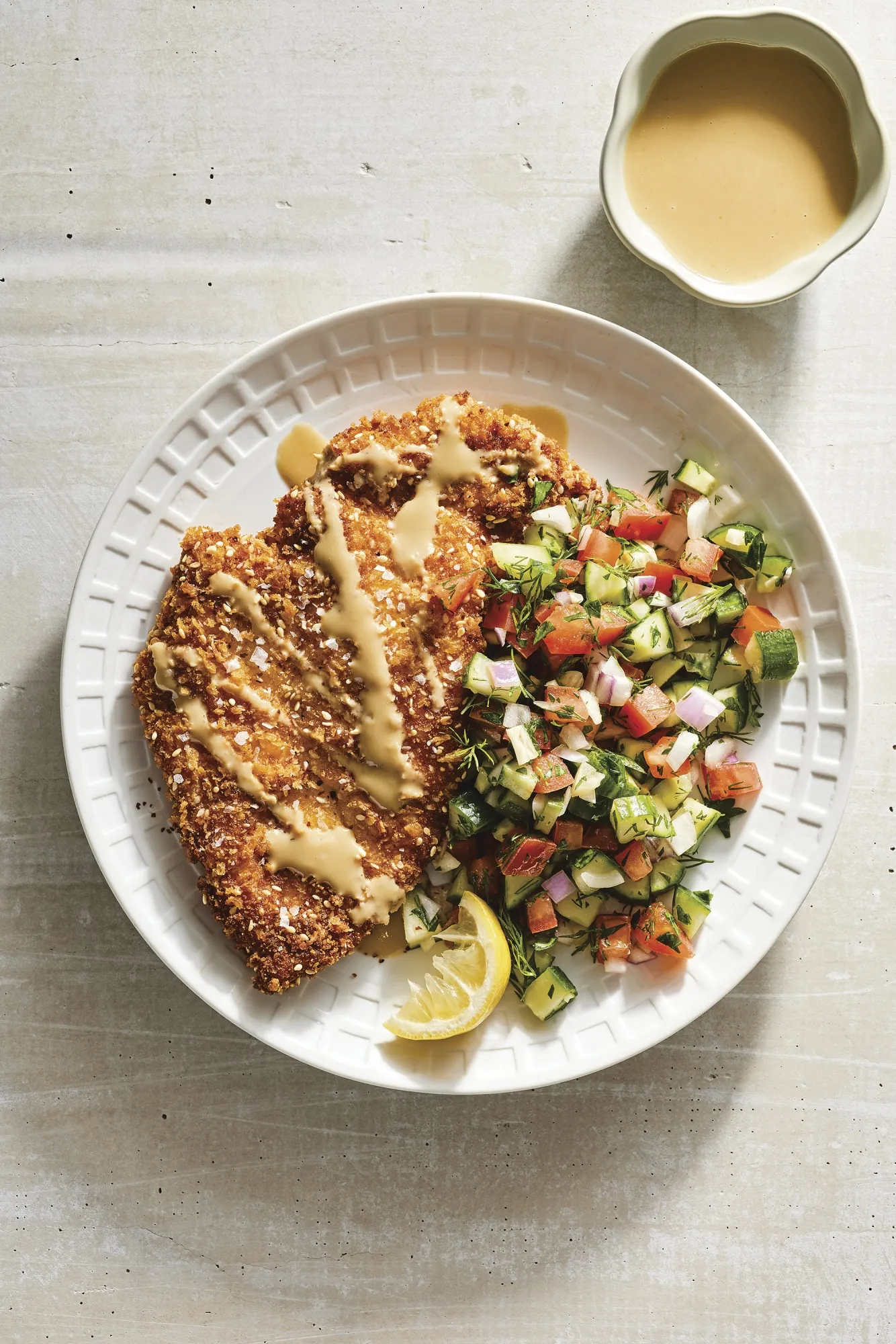 This image released by Clarkson Potter shows a recipe for Sesame Schnitzel, featured in the cookbook "Eitan Eats the World" by Eitan Bernath. (Mark Weinberg/Clarkson Potter via AP)