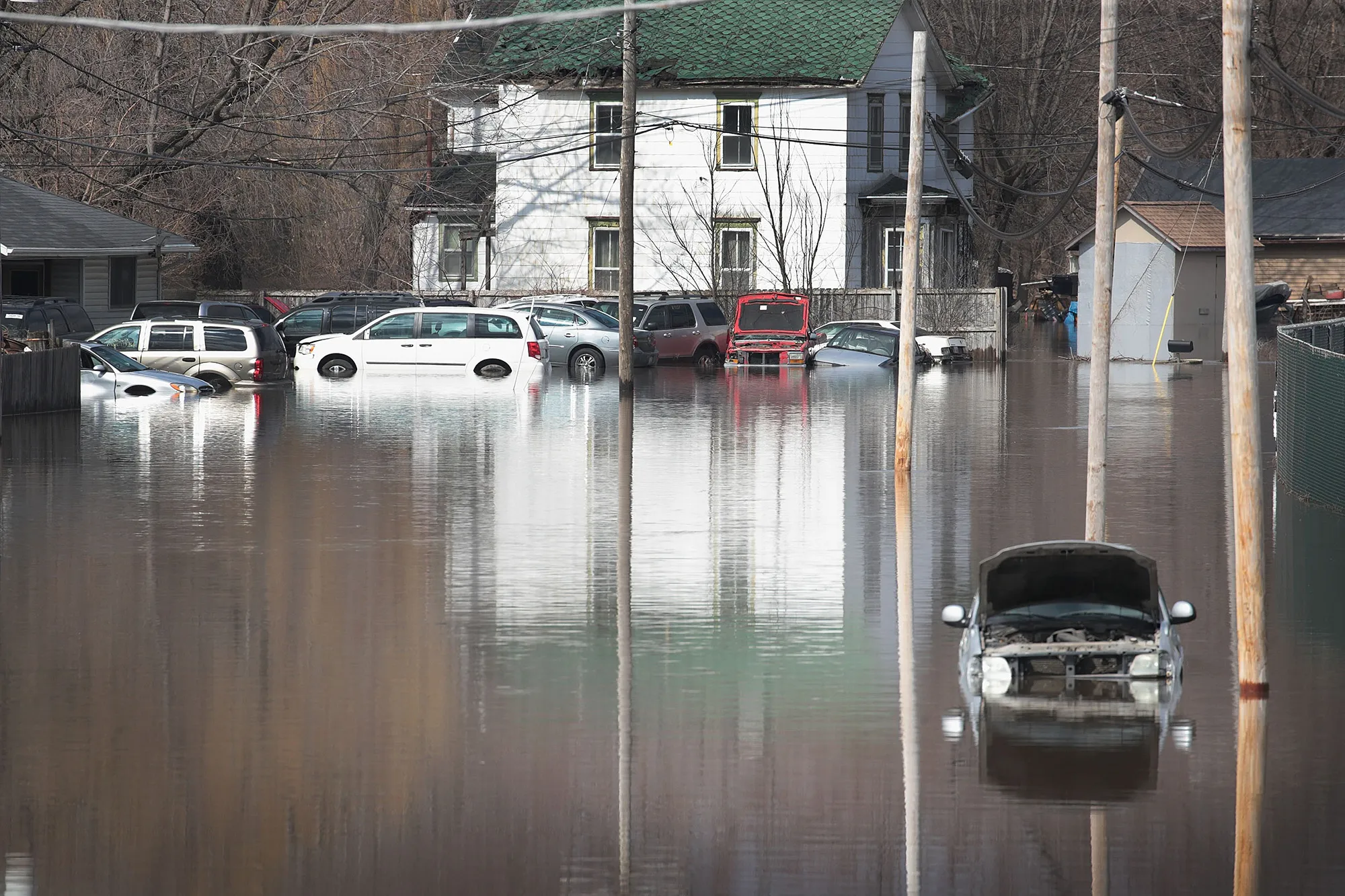 Cars sit in floodwater from the Pecatonica River in Freeport, Illinois on March 18, 2019.