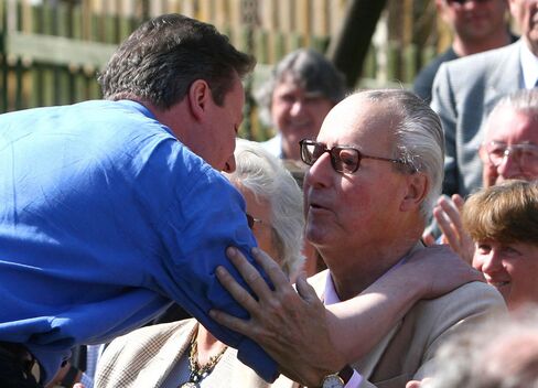David Cameron greets his father Ian in 2010.