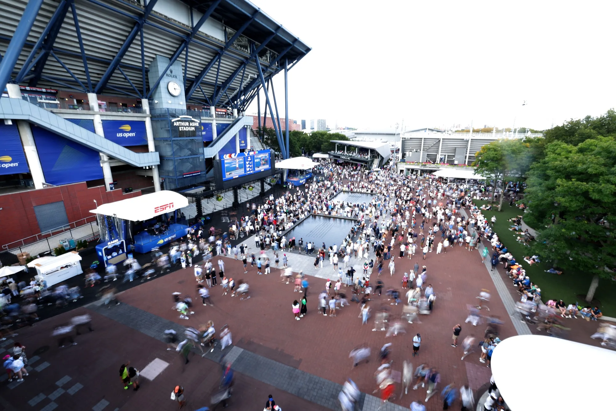 NEW YORK, NEW YORK - AUGUST 28: Fans traverse between courts outside of Arthur Ashe Stadium on Day Five of the 2025 US Open.