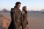 This image released by Warner Bros. Pictures shows Timothee Chalamet, left, and Rebecca Ferguson in a scene from &quot;Dune.&quot; (Warner Bros. Pictures via AP)