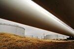 Oil pipelines feed into storage tanks at an Enbridge terminal in Cushing, Oklahoma.