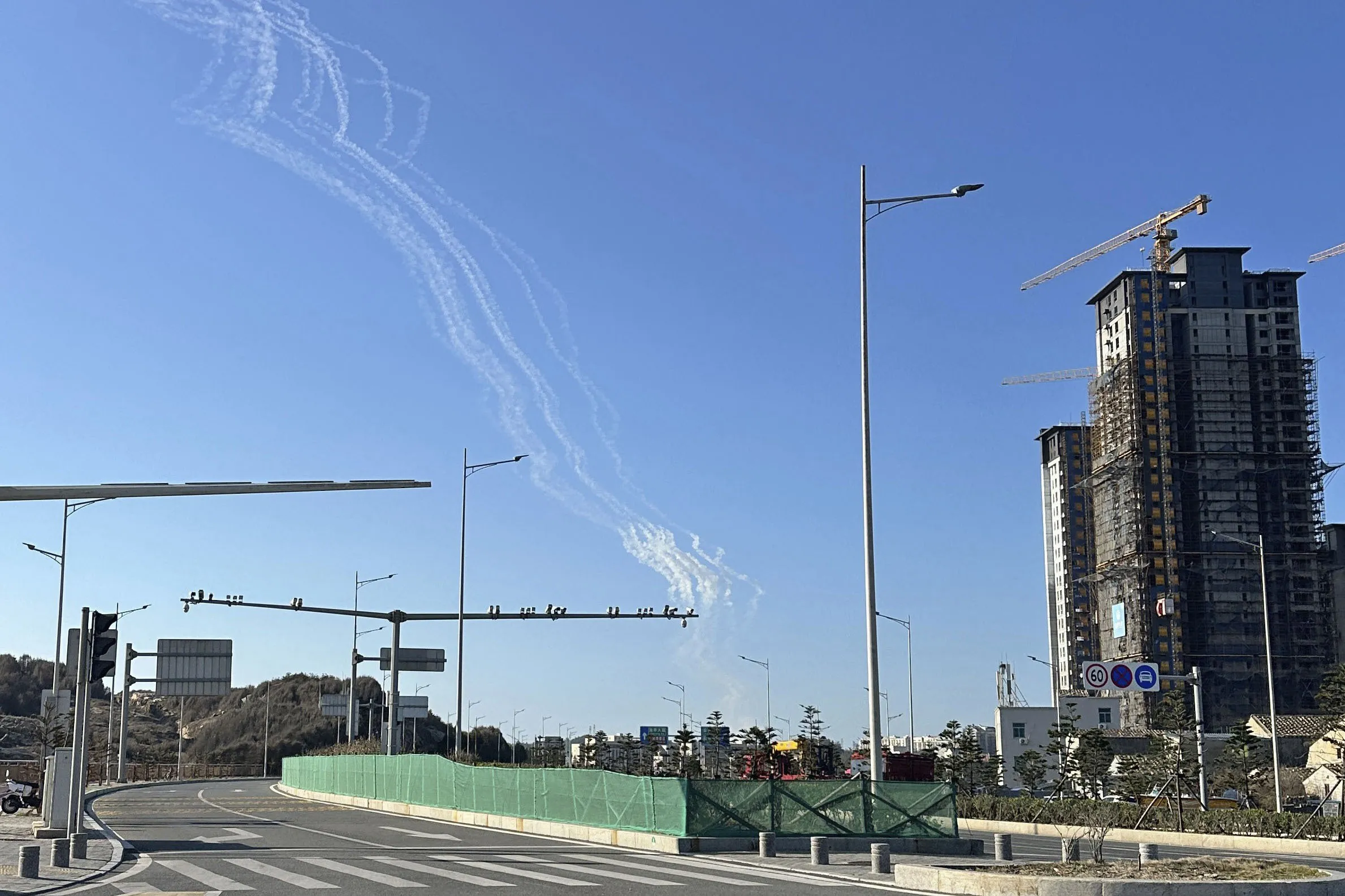 Streaks from projectiles launched from Pingtan Island in the Taiwan Strait as China continues military drills around Taiwan on Dec. 30.