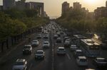 Traffic travel along a road in Beijing, China.