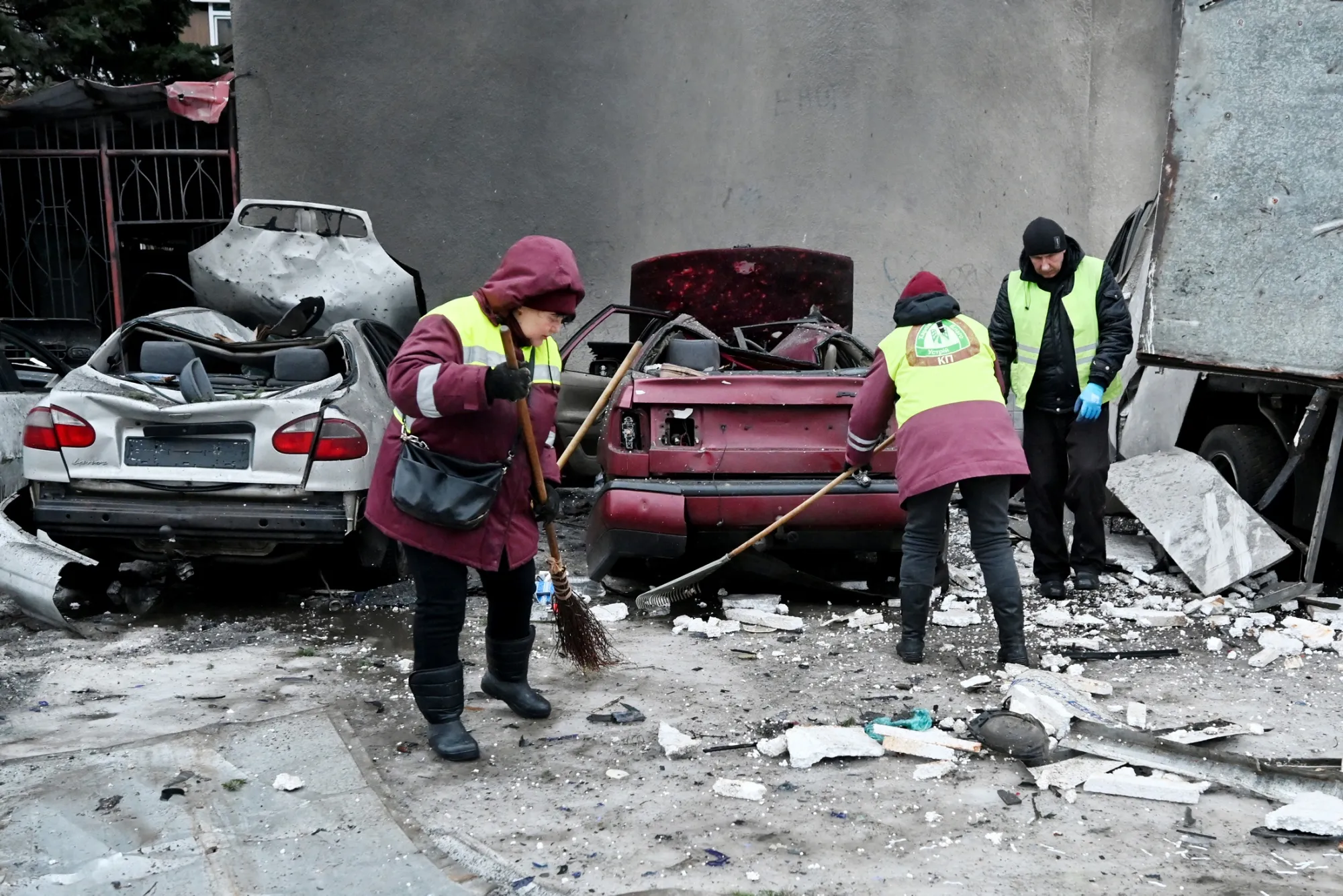 Workers clear debris following a Russian attack in Kharkiv, Ukraine, on Feb. 26.