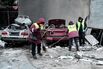Workers clear debris following a Russian attack in Kharkiv, Ukraine, on Feb. 26.