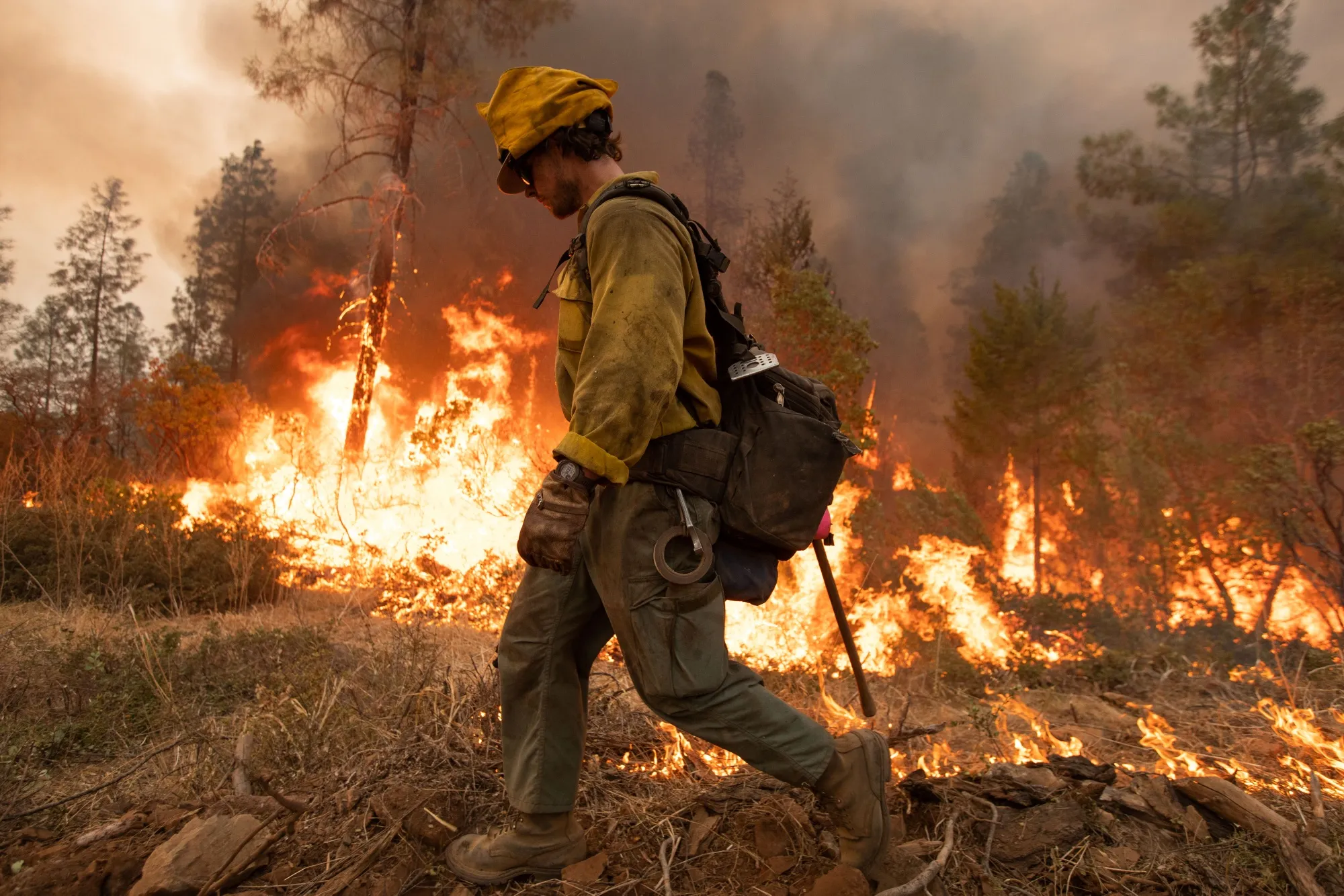 A firefighter uses a drip torch during the Mosquito fire near Volcanoville, California.