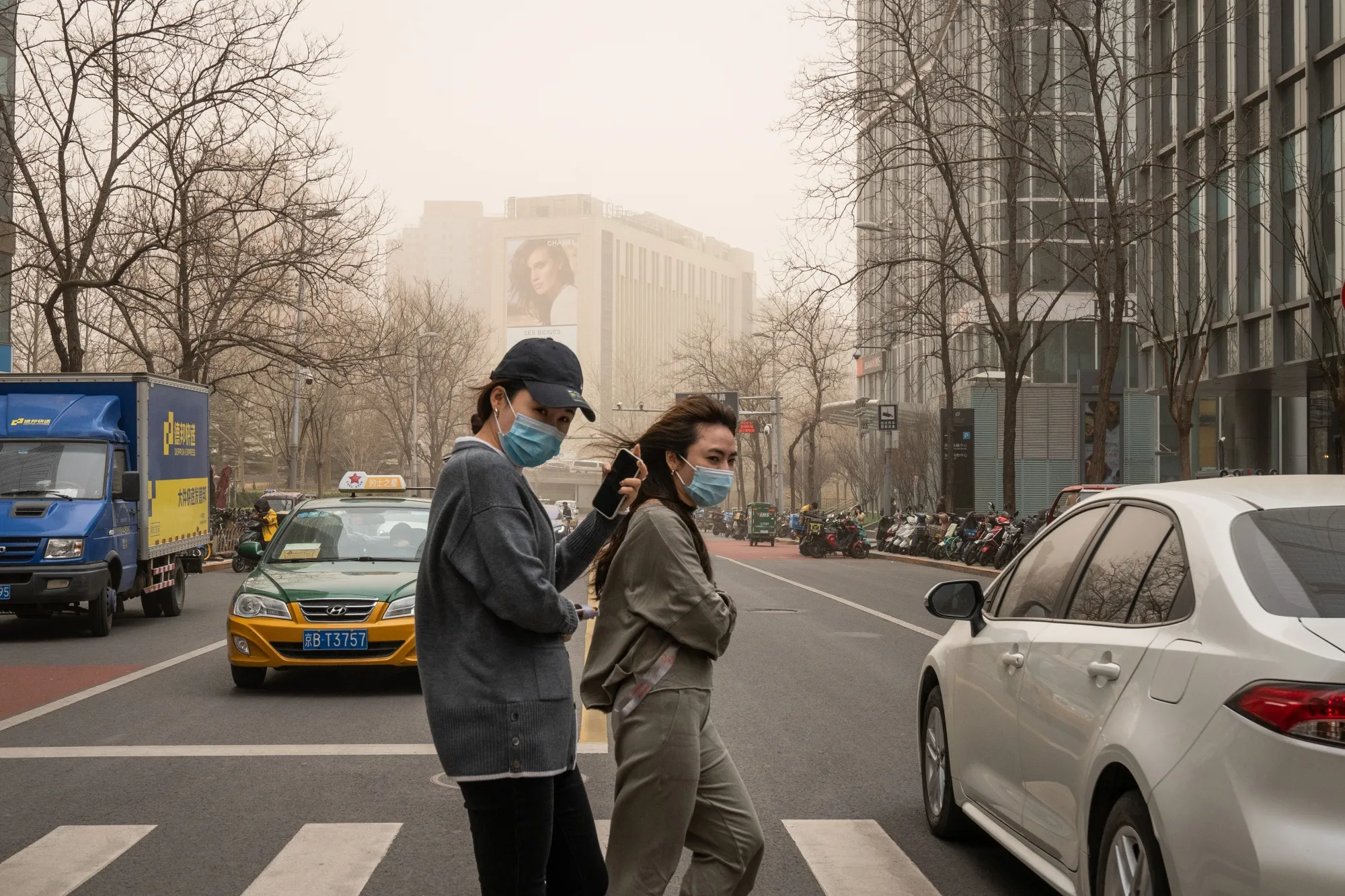 Pedestrians in Beijing, which&nbsp;was&nbsp;shrouded in polluted air after a&nbsp;sandstorm in March&nbsp;2021.&nbsp;