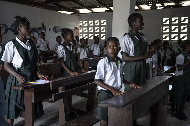 Children attend a lesson inside the renovated plantation school.